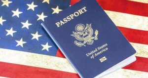 Image of US passport over portion of US flag